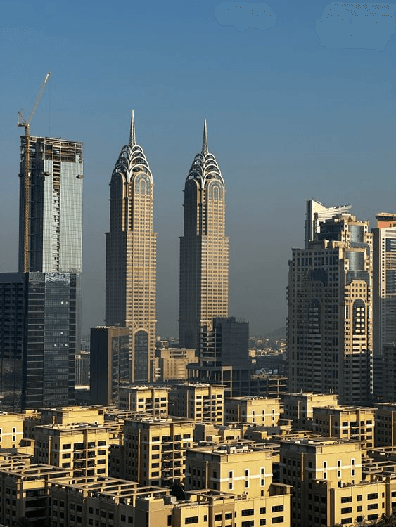Modern twin towers architecture in Dubai representing institutional growth and strength